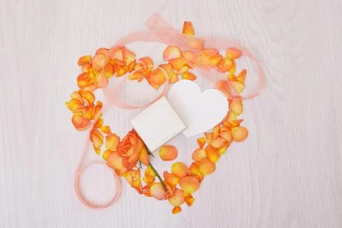 Creative mock up made of roses  with copy space on table. Empty sheet of card Stock Photos