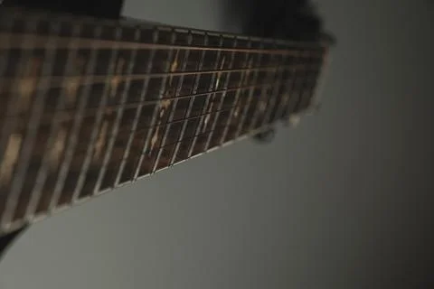 Creative moment captured on guitar strings with a unique angle and soft lighting Stock Photos