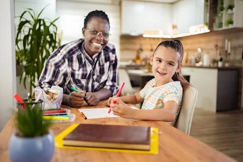 Creative moments between a joyful mentor and a young artist Stock Photos