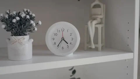 Creative moments with a clock and plants in cozy decor Stock Footage 338321331