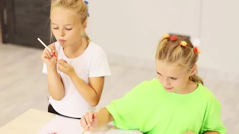 Creative moments of two girls exploring art and imagination at play Vídeo Stock 296332609