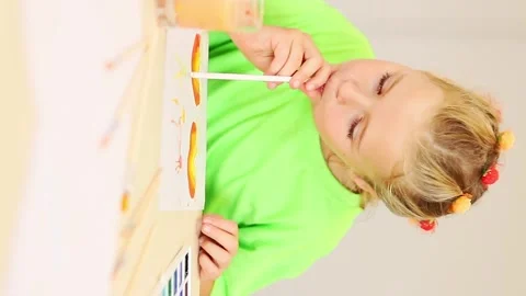 Creative moments of a young artist exploring colors and imagination Stock-Footage 296332745