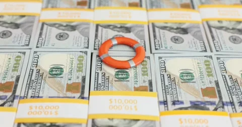 Creative money management techniques using a life preserver and a stack of cash Video stock 294599142