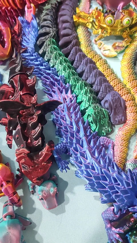 Creative multi-colored models printed on 3D printer from molten plastic Vertical Stock Footage 303359501