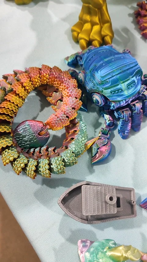 Creative multi-colored models printed on 3D printer from molten plastic Vertical Stock Footage 303837936