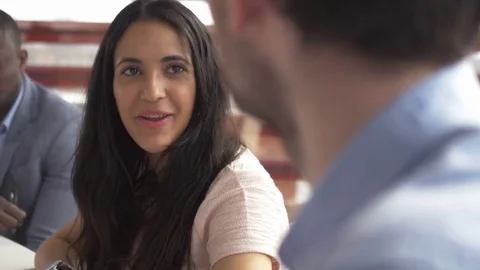 Creative multi-ethnic employees talking in a morning meeting Stock Footage 73855273