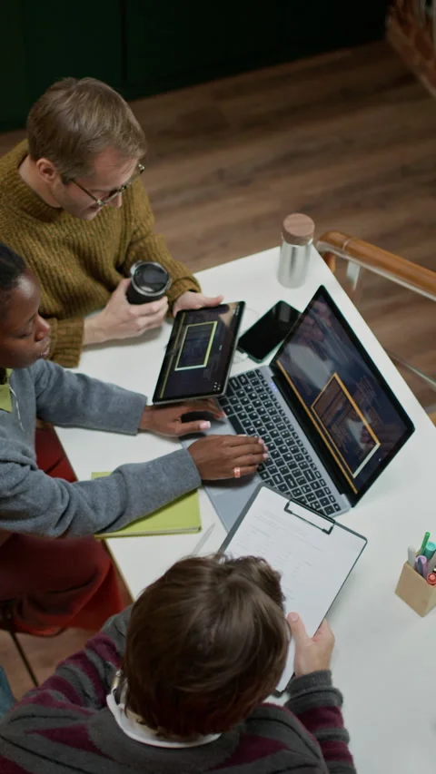Creative Multiethnic Programmers Brainstorming for IT Startup in Modern Office Stock-Footage 320002441