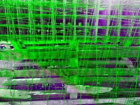 Creative neon background abstract made of wire. Space copy. Green texture m.. 스톡 사진