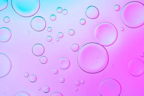 Creative neon background with drops. Glowing abstract backdrop with vibrant Stock Photos