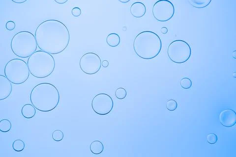 Creative neon background with drops. Glowing abstract backdrop with vibrant Stock Photos