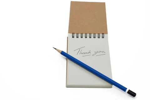 Creative Notepad With a Handwritten Thank You Note and a Blue Pencil on a C.. Stock Photos