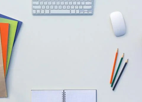 Creative Office Bright Table with Matching Color Magazines and Pencils Computer Stock Photos