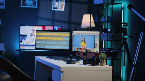 Creative office in media company with multi monitor computer setup used for Stock Footage 257498299