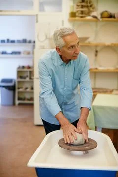 Creative, old man and mold at pottery workshop with wheel for ceramics, ret.. Stock Photos
