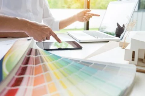 Creative or Interior designers teamwork with pantone swatch and building plan Stock Photos