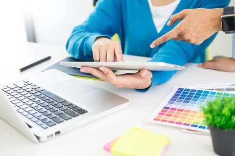 Creative or Interior designers teamwork with pantone swatch and building plan Stock Photos
