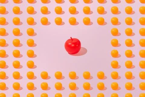 Creative orange and apple pattern flat lay on pastel pink background minimali Stock Photos