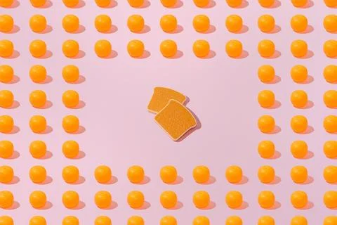 Creative orange and toast bread pattern flat lay on pink background minimalis Stock Photos