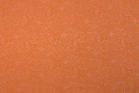 Creative orange fabric with floral pattern and textile texture background Stock Photos
