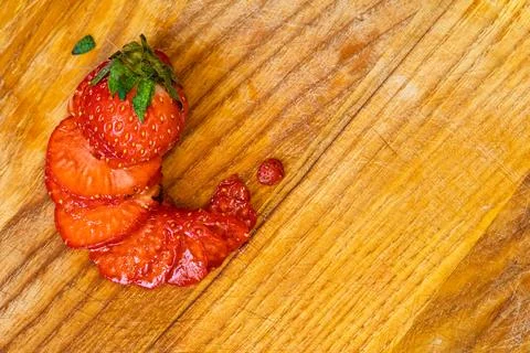 A creative overhead image of fresh red strawberry slices arranged in a spir.. Stock Photos