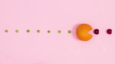 Creative Pac - man game made of fresh orange eat cherries and peas. Stop motion 스톡 동영상 154555624