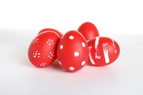 Creative painted red Easter eggs on white background Stock Photos