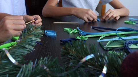 Creative paper Christmas tree. Quilling. children's hands make quilting crafts Stock Footage