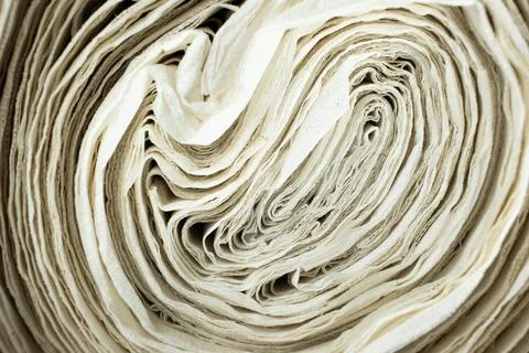 Creative paper roll swirl pattern close up. Stock Photos