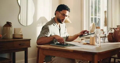 Creative, paperwork and man with laptop, home and search for logo design on.. Stock Photos