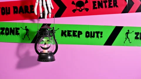 Creative Pastel Halloween Background: Skeleton Hand hold Lantern Stock Footage 251495867