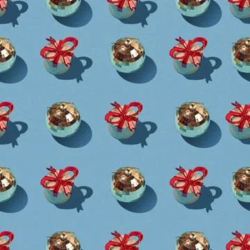 Creative pattern of Christmas decorations balls on light blue background Stock Photos
