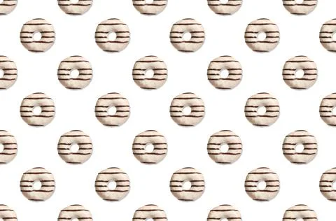 Creative pattern design of glazed donuts on white background Stock Photos
