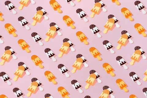 Creative pattern ice cream chocolate and vanilla popsicle pastel pink backg.. Stock Photos