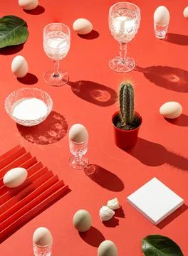 Creative pattern made with champagne, vine glass, easter eggs, cactus, white  Foto stock