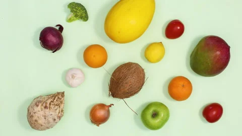 Creative pattern made of fruits and vegetables appear. Stop motion Stock Footage 154524241