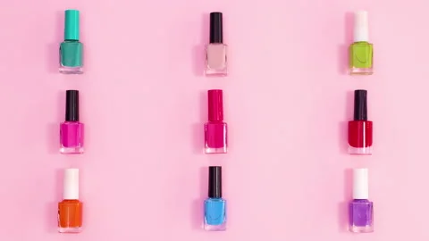 Creative pattern made of manicure nail polish bottles move. Stop motion Stock Footage 153294917