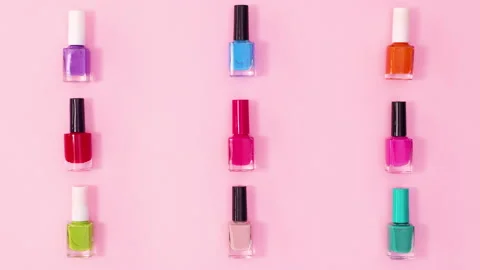 Creative pattern made of manicure nail polish bottles rotating. Stop motion Stock Footage 153295104