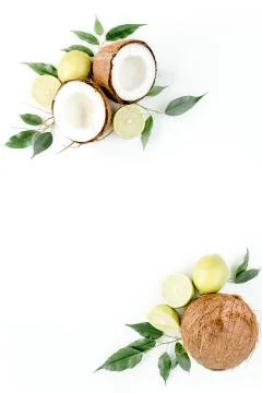 Creative pattern made of summer tropical fruits: coconut, lime and leaves ficus Foto stock