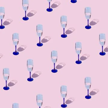 Creative pattern made with wineglass on pink pastel backdrop. Minimal party b 스톡 사진