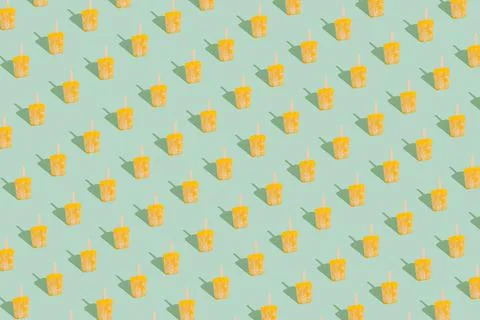 Creative pattern made with yellow sorbet ice cream . Stock Photos