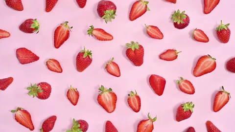 Creative pattern with organic strawberries on pink background. Stop motion Video stock 192463048