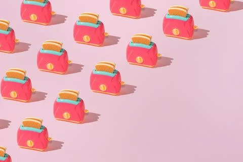 Creative pattern with slices of toast bread and toaster flat lay on pastel pi Stock Photos