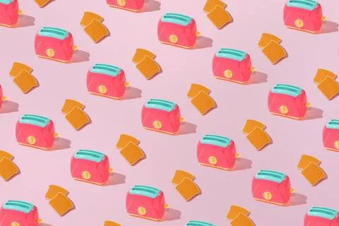 Creative pattern with slices of toast bread and toaster flat lay on pastel pi Stock Photos