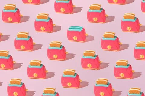 Creative pattern with slices of toast bread and toaster flat lay on pastel pi Stock Photos