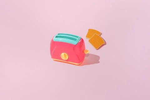 Creative pattern with slices of toast bread and toaster flat lay on pastel pi Stock Photos