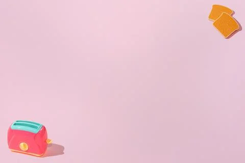 Creative pattern with slices of toast bread and toaster flat lay on pastel pi Stock Photos