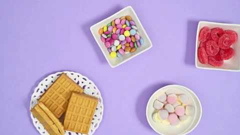 Creative pattern with sweets, candies and lollipops. Stop motion flat lay Video stock 170020709