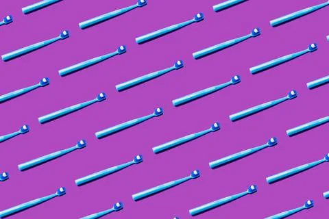 Creative pattern toothbrush white toothpaste purple background flat lay top.. Stock Photos