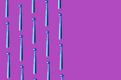 Creative pattern toothbrush white toothpaste purple flat lay top view copy .. Stock Photos