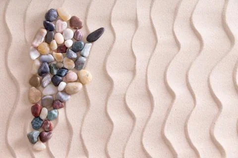 Creative pebble map of Argentina on beach sand Stock Photos